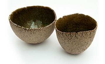 Pair of bowls with a green shiny interior